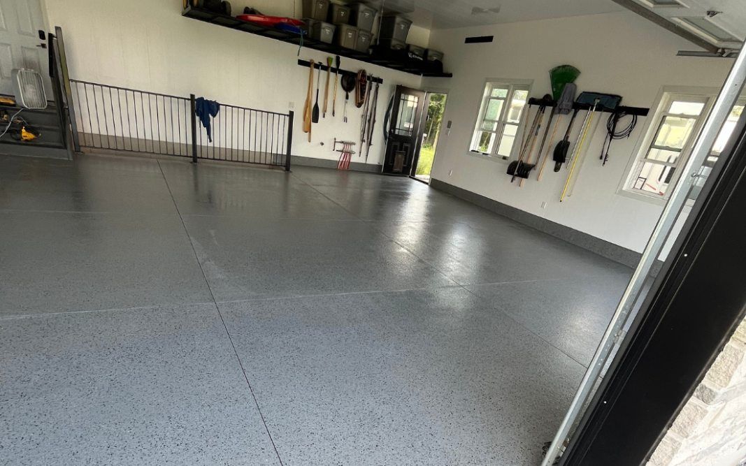 Garage floor coated in polyaspartic flooring by Pryce Designs