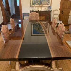 Dark walnut dining table with black epoxy